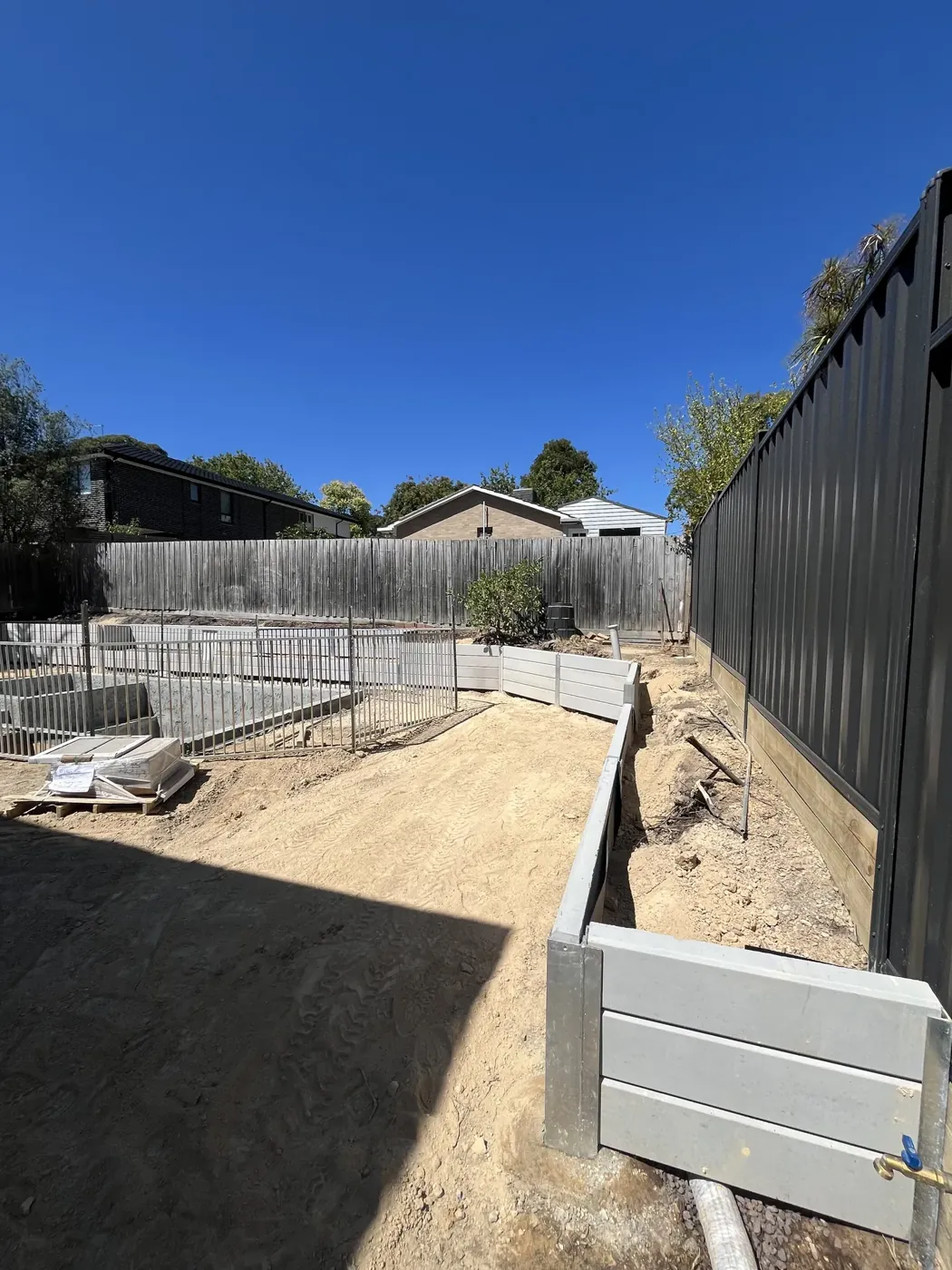 Completed concrete sleeper retaining wall